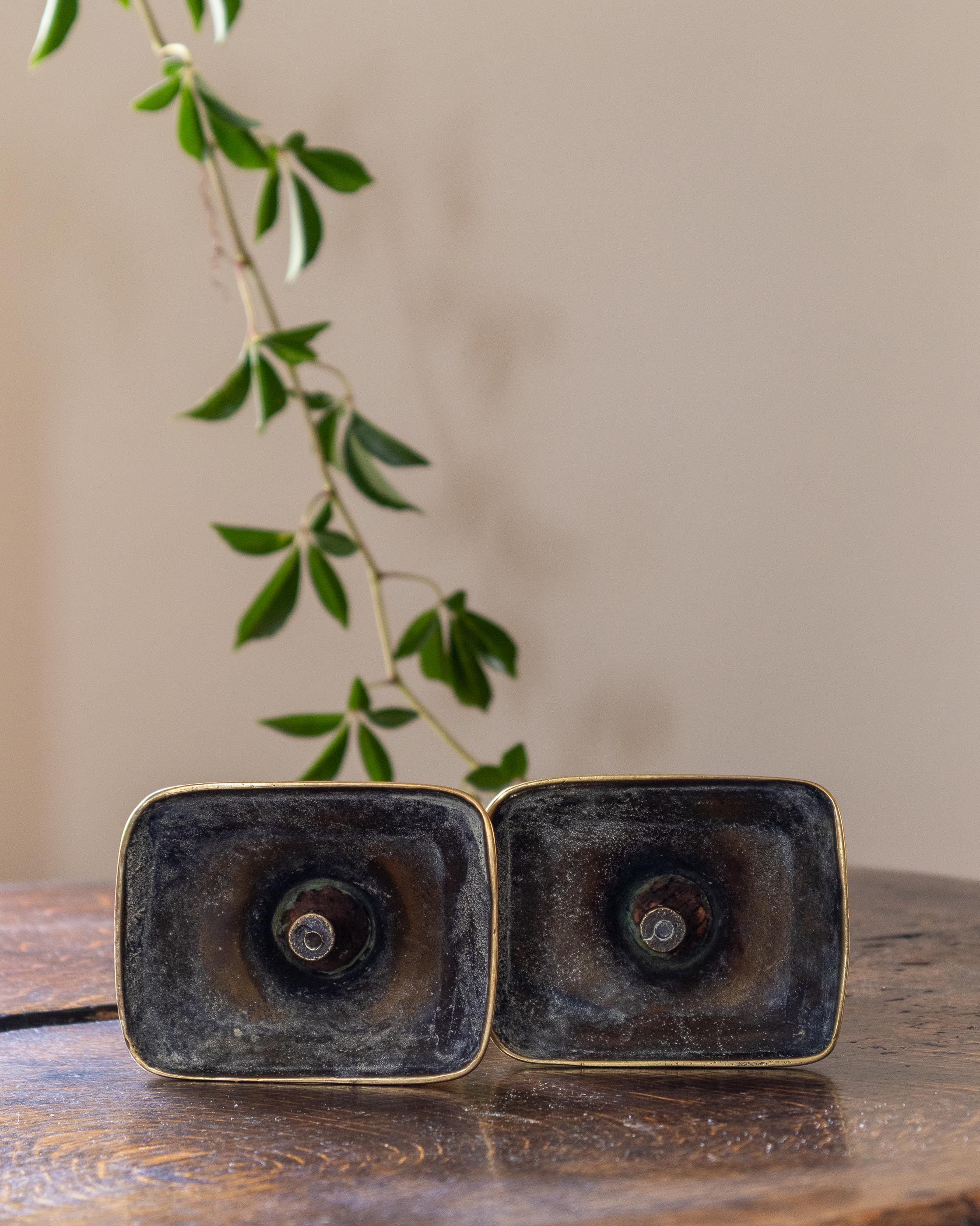 Brass candlestick on a wooden surface