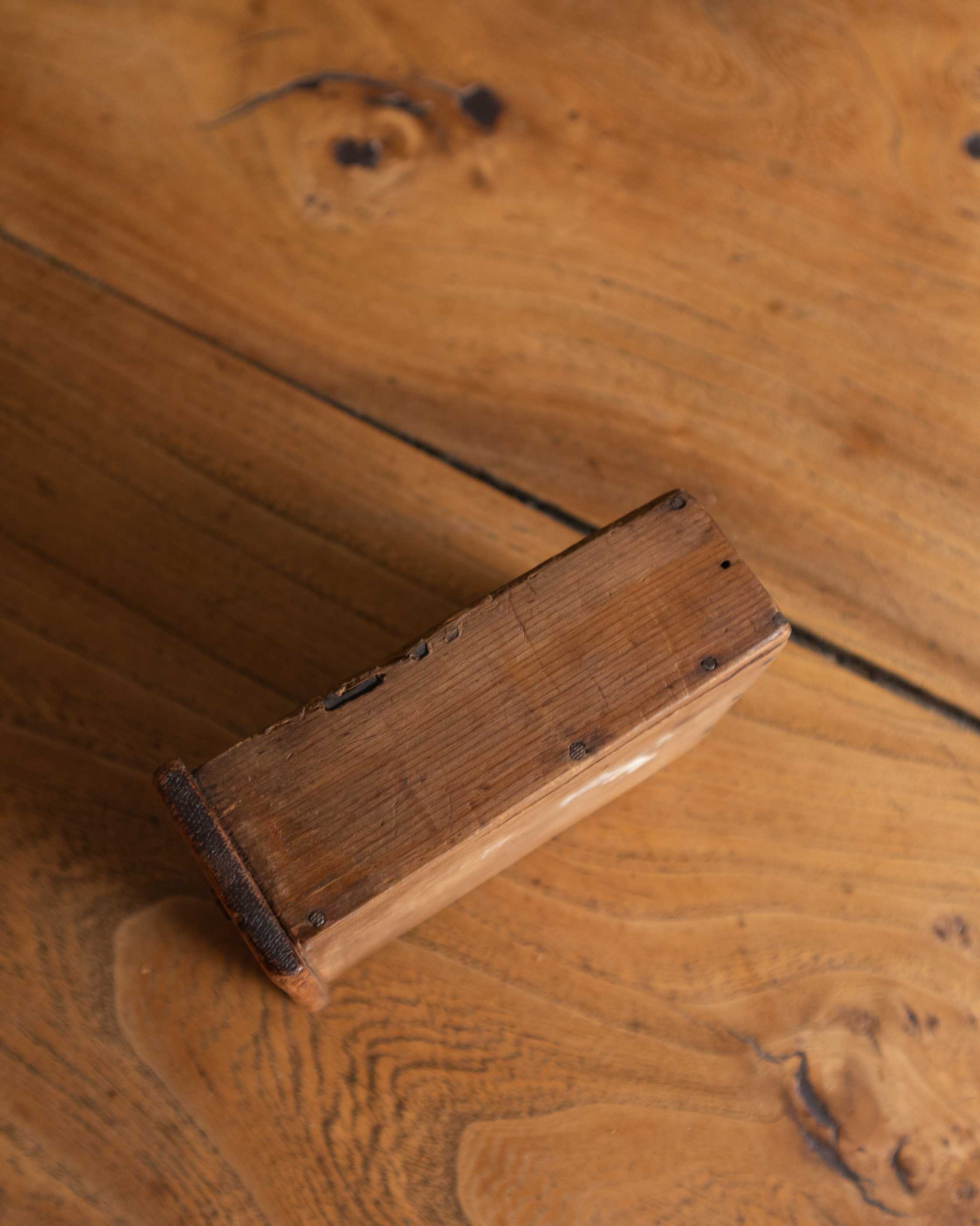 Close-up of a wooden drawer on a wooden surface
