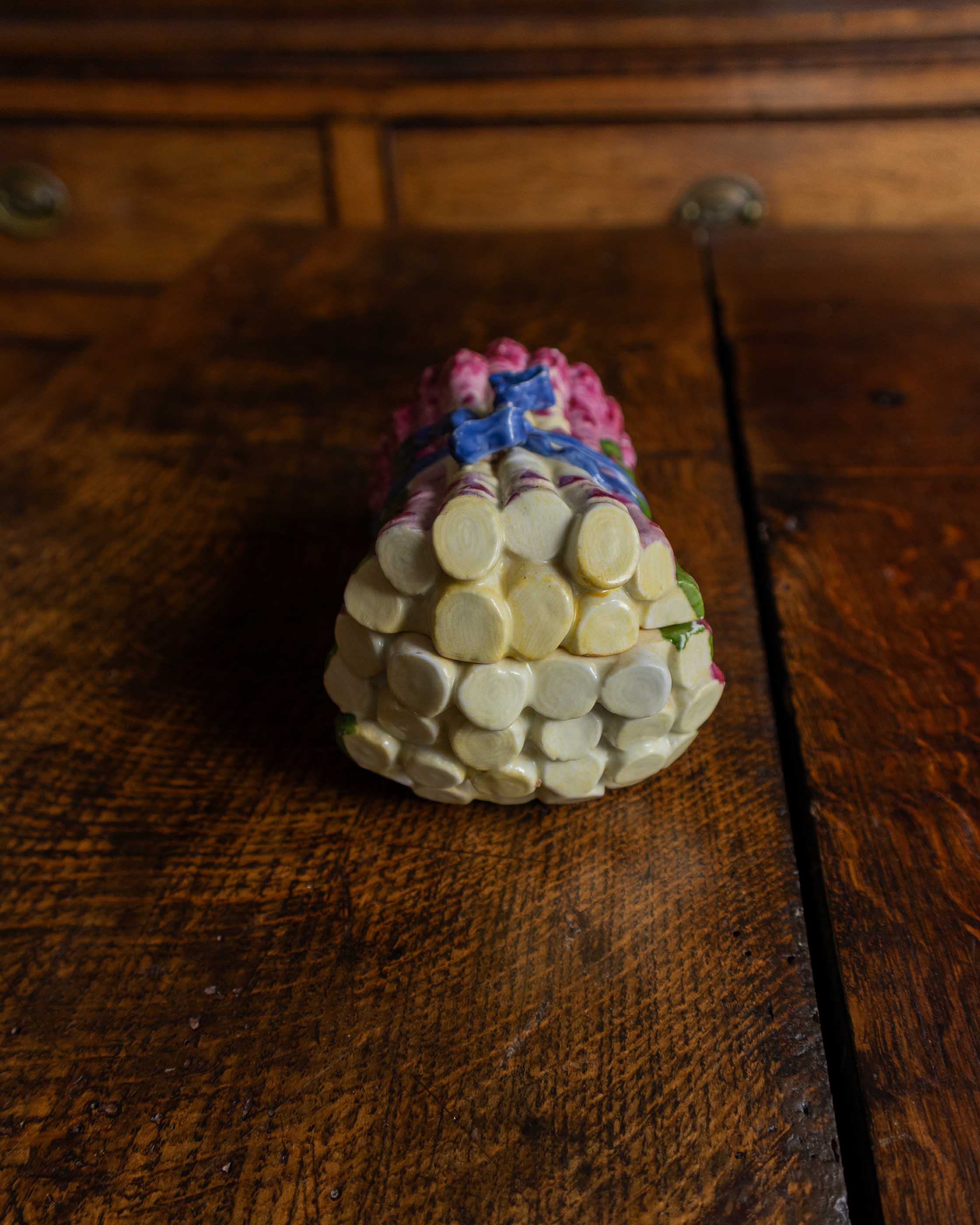 Small decorative ceramic box on a wooden surface