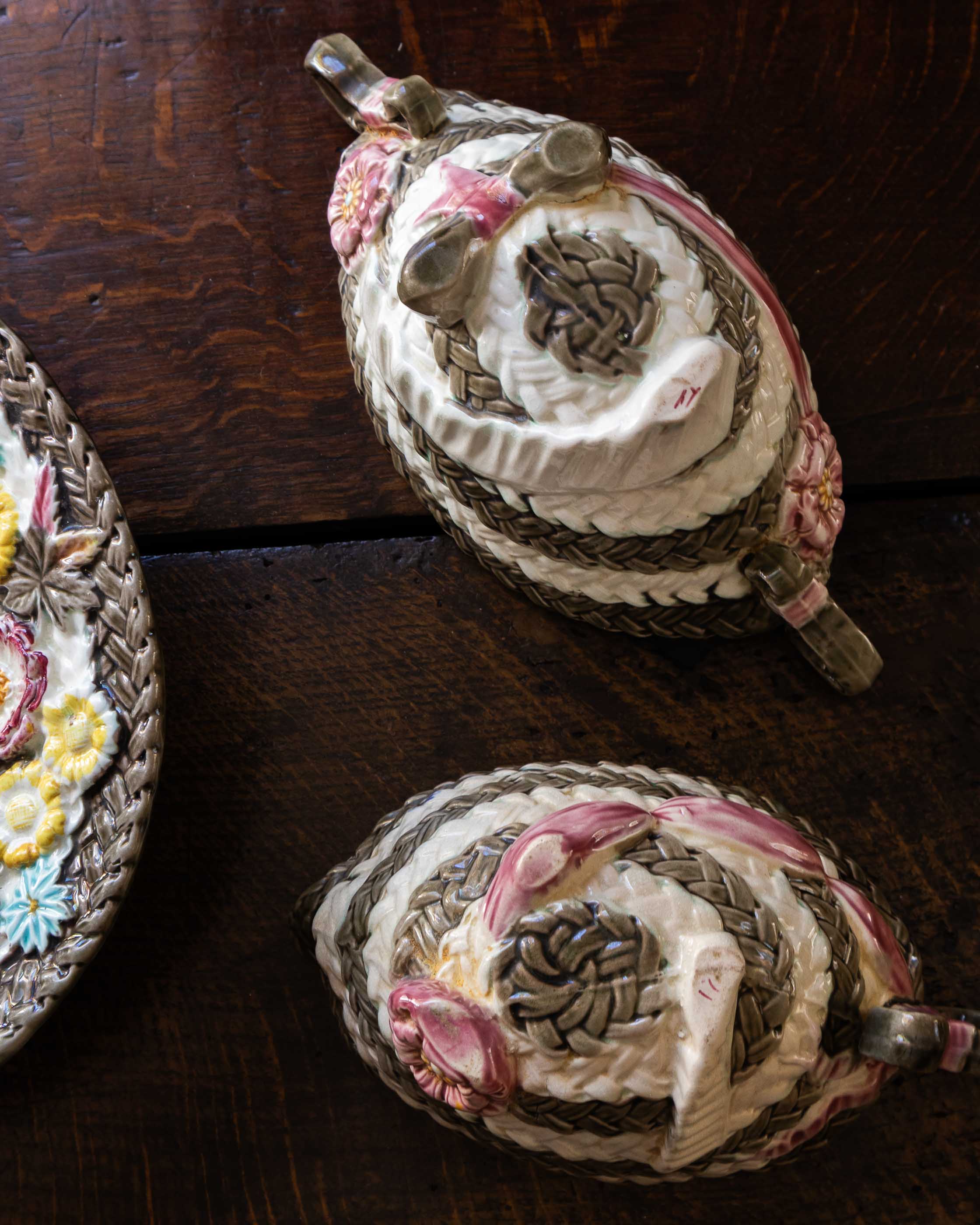 Decorative woven baskets with intricate patterns on a wooden surface