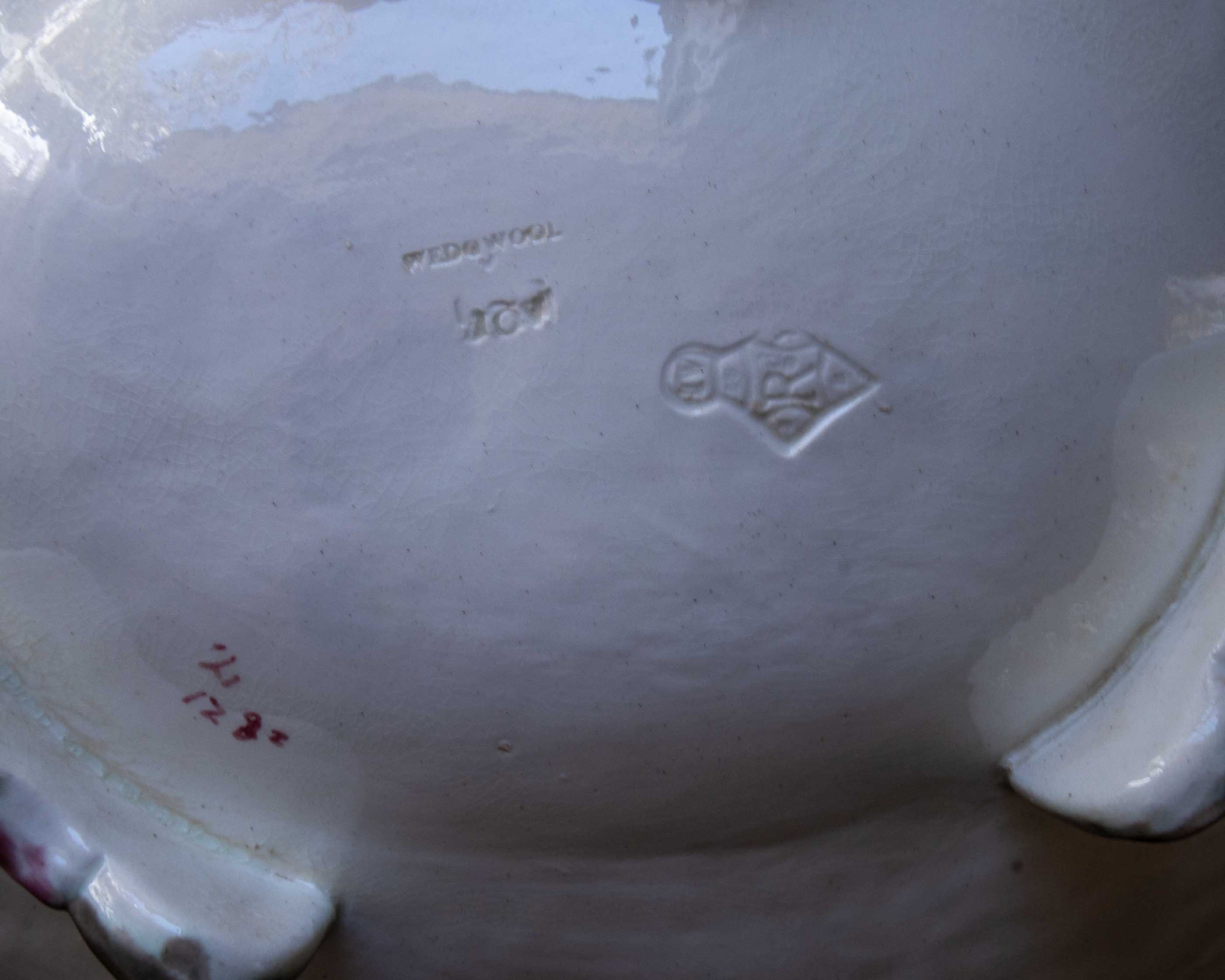 Close-up of a ceramic dish with visible branding and text.