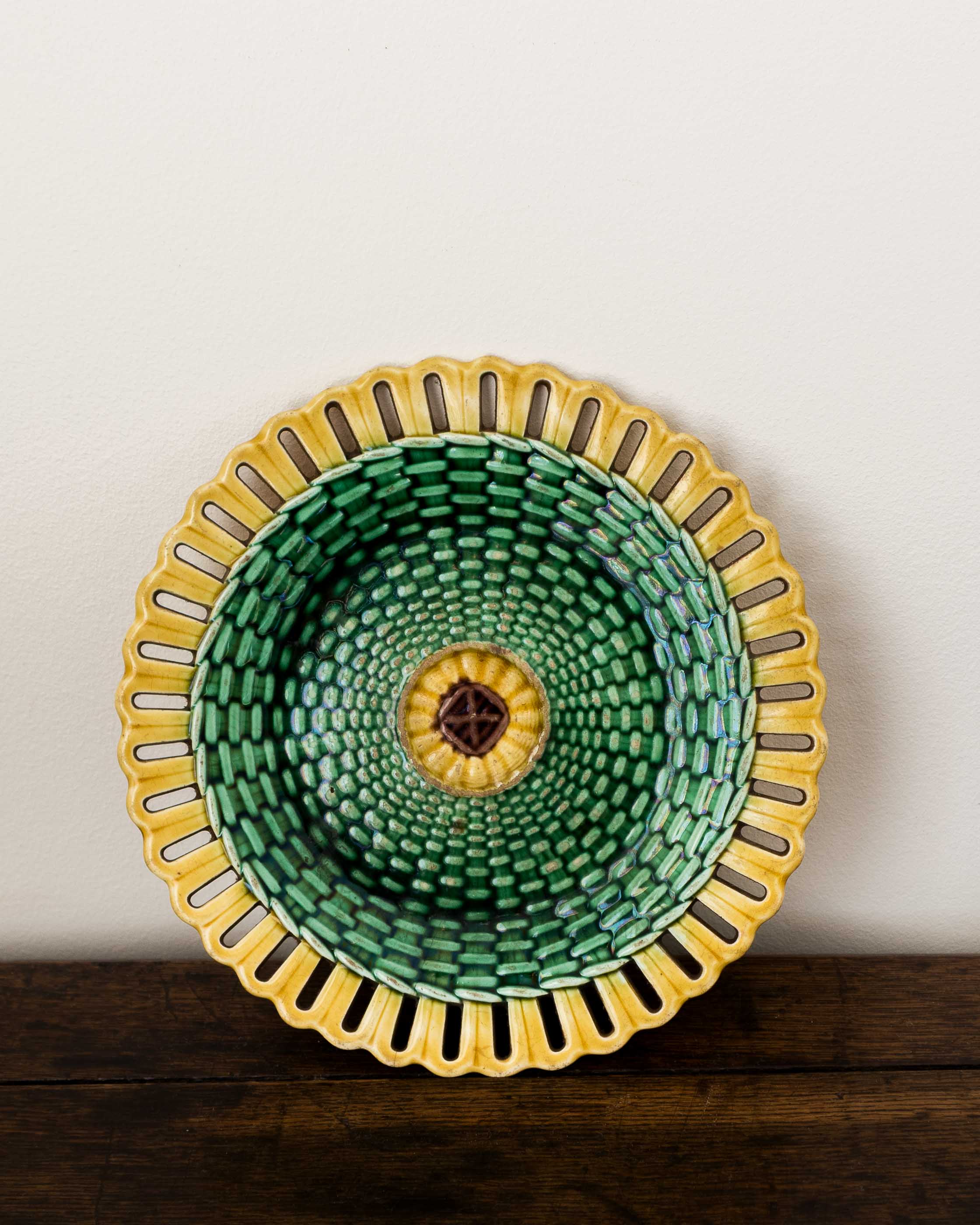 Ceramic plate with green center and yellow rim on a wooden surface