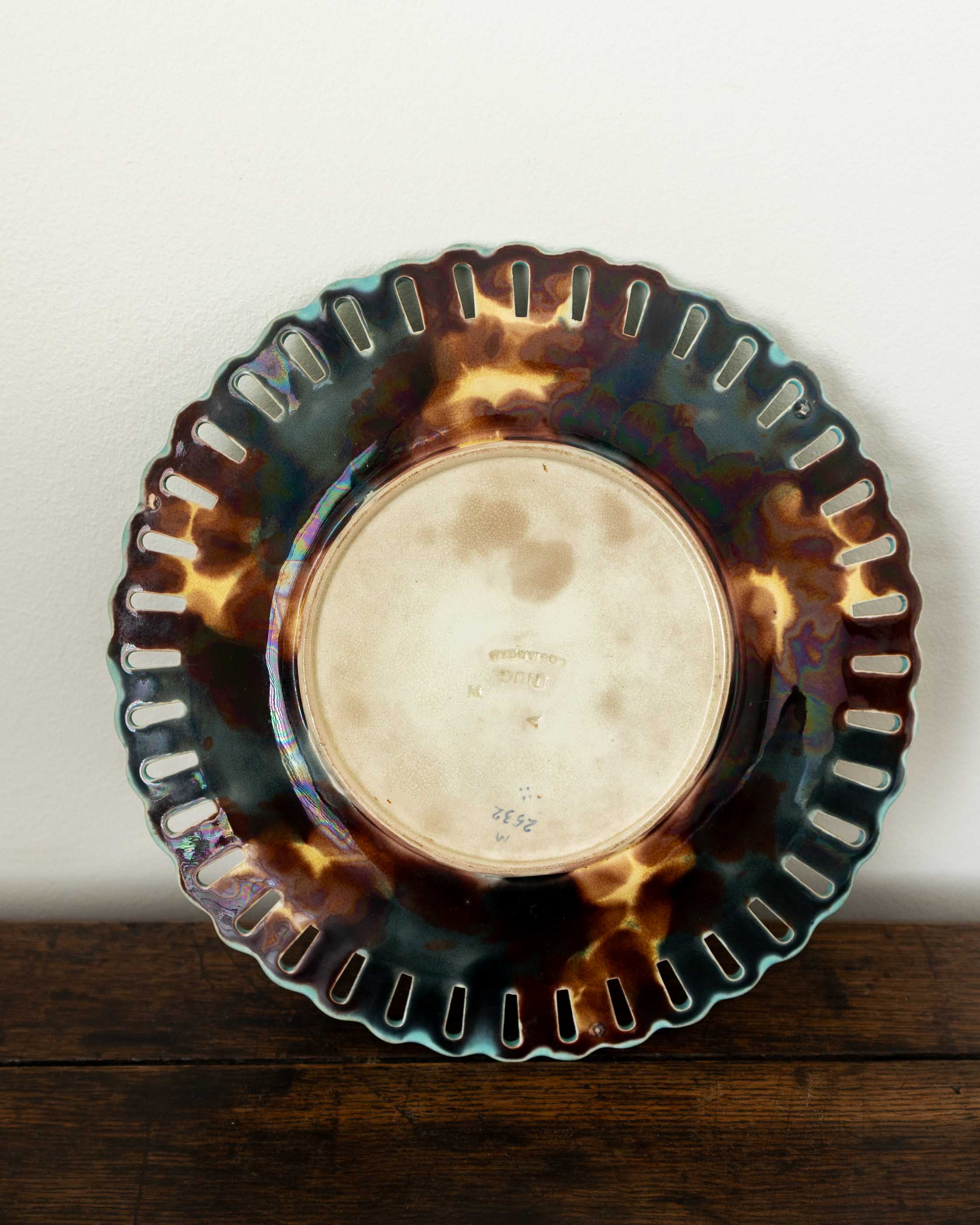 Decorative glass plate with a scalloped edge on a wooden surface