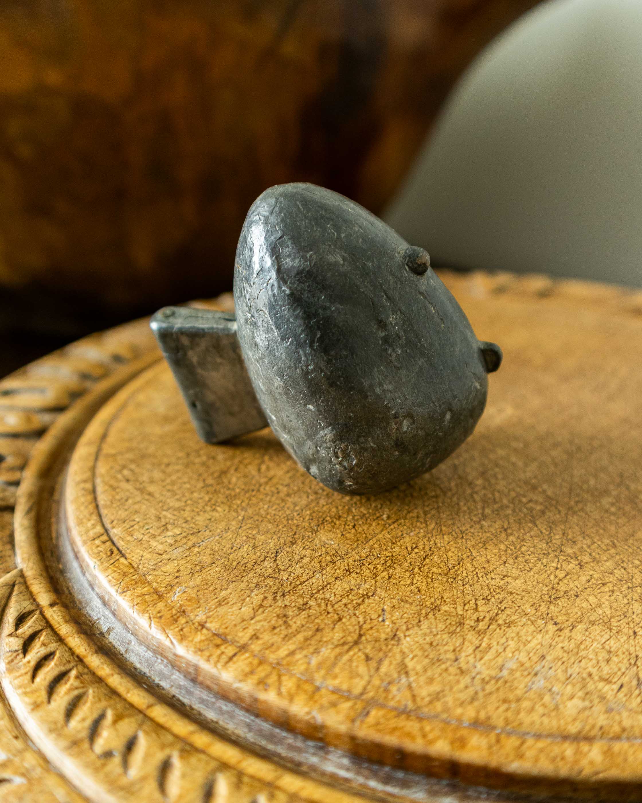 Strawberry pewter ice cream mould on wooden breadboard