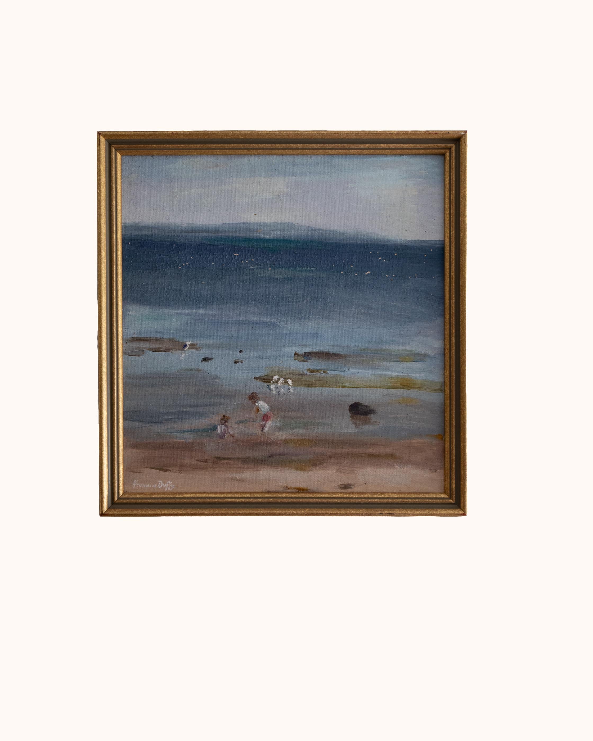 Framed painting of a beach scene with children and seagulls.