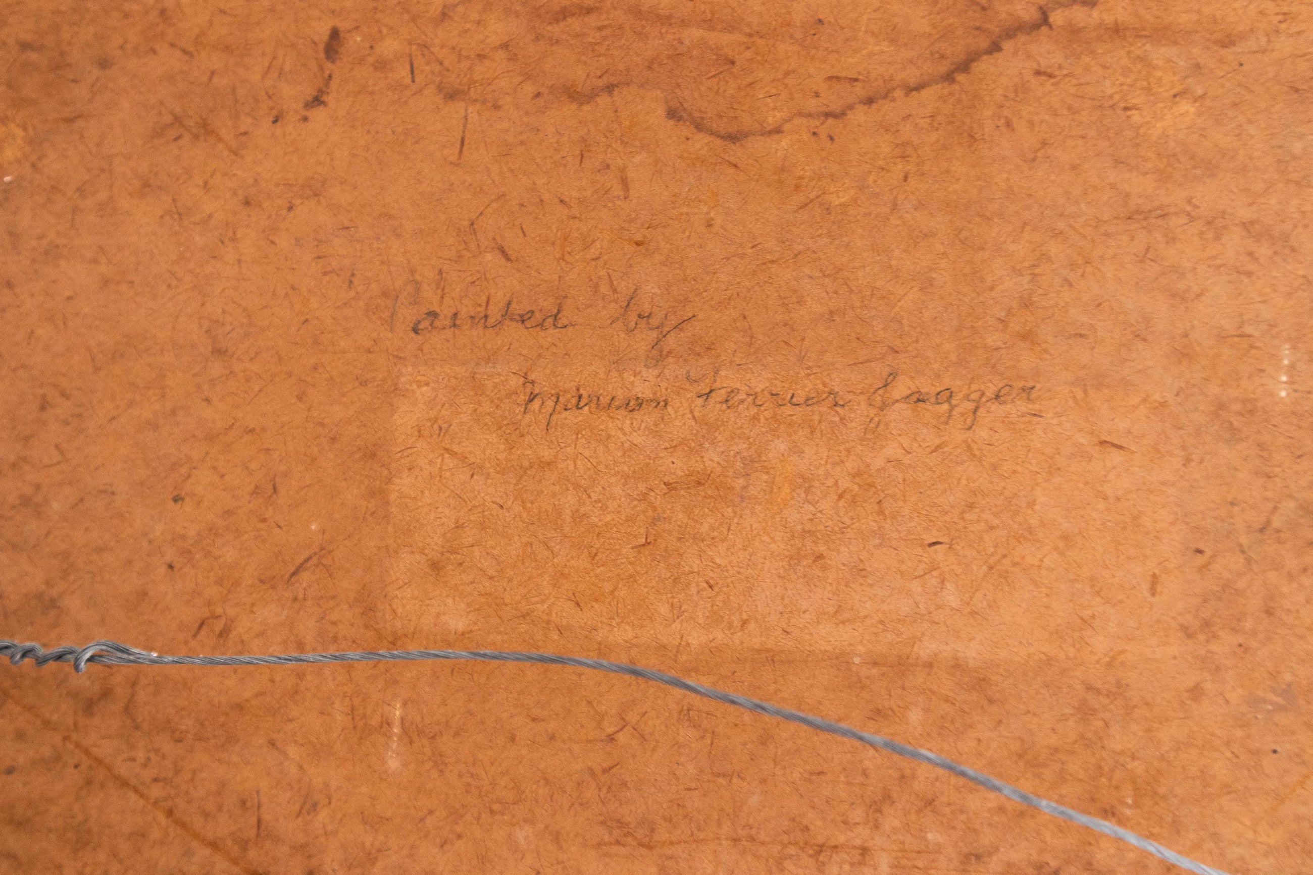 Brown textured surface with a signature