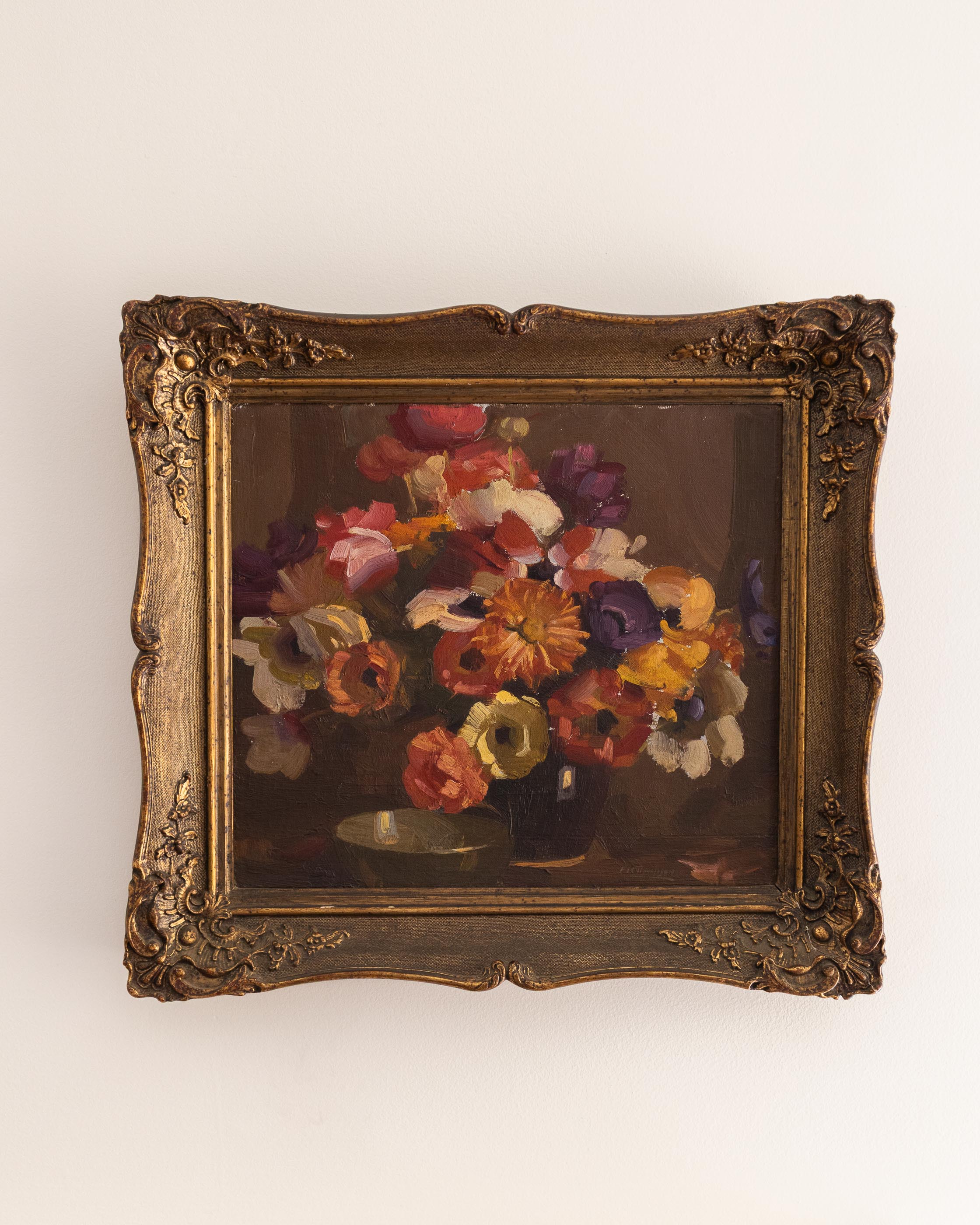 Framed painting of a still life with flowers on a white background
