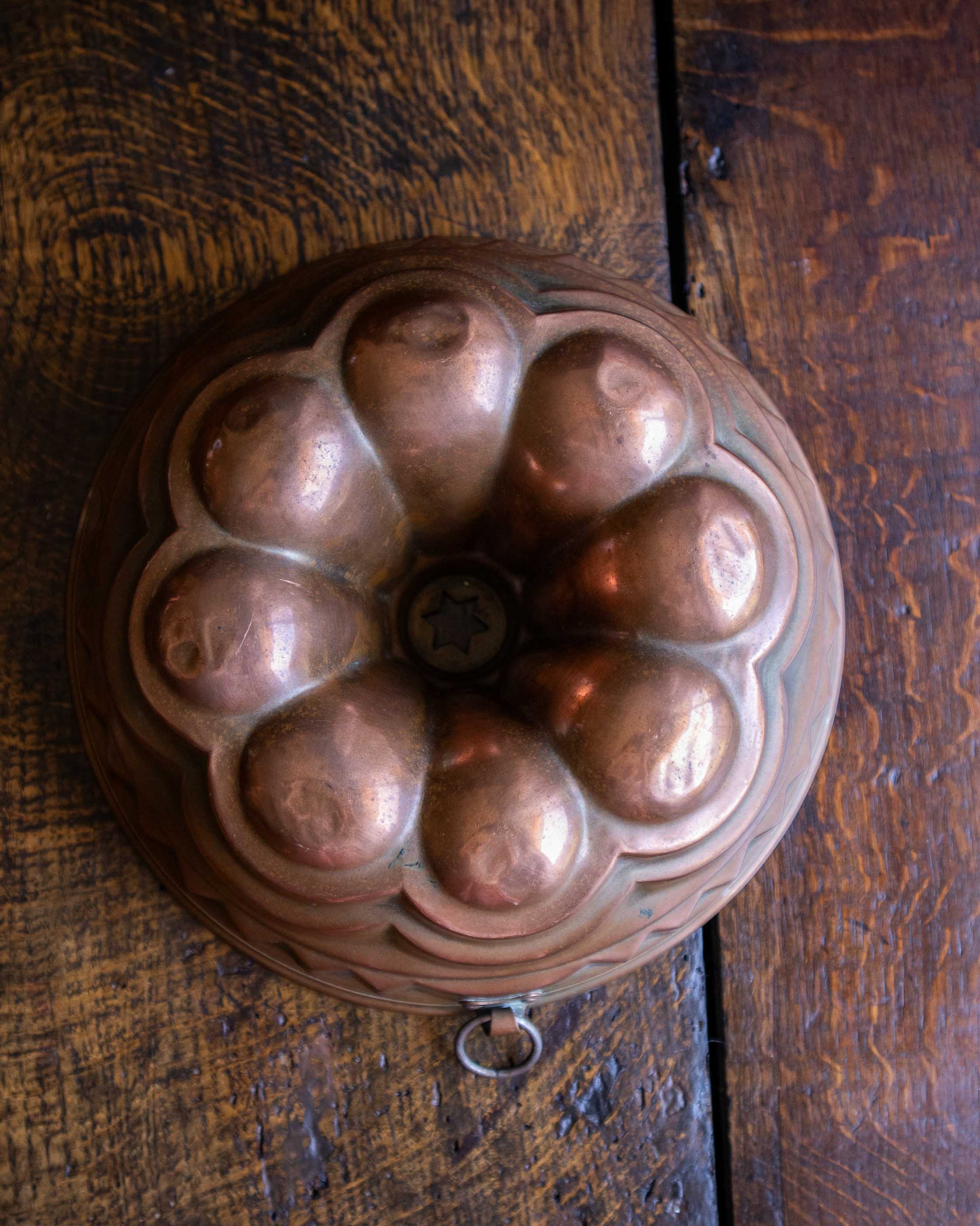 Copper mould on a wooden surface