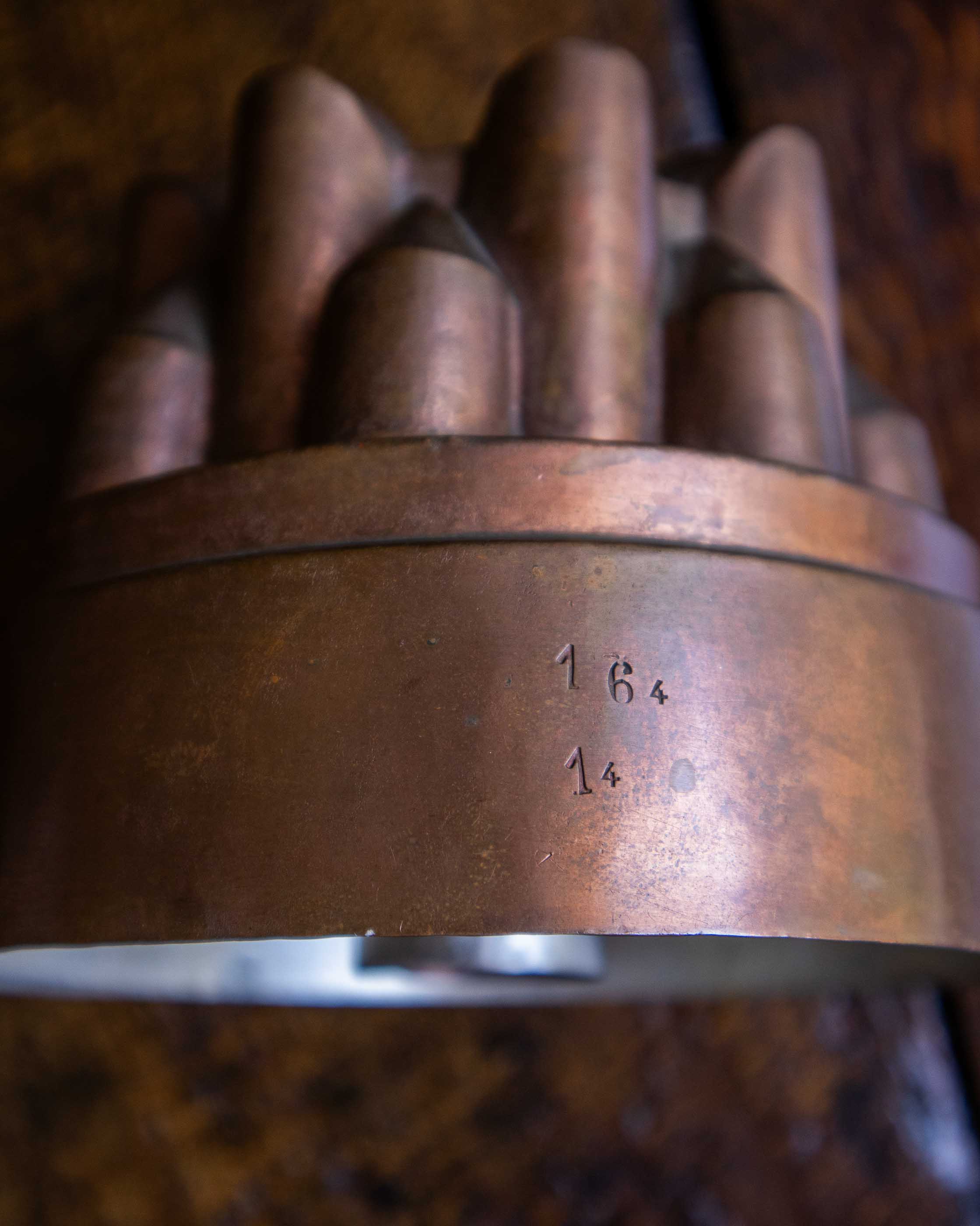 Decorative copper jelly mould on a wooden surface