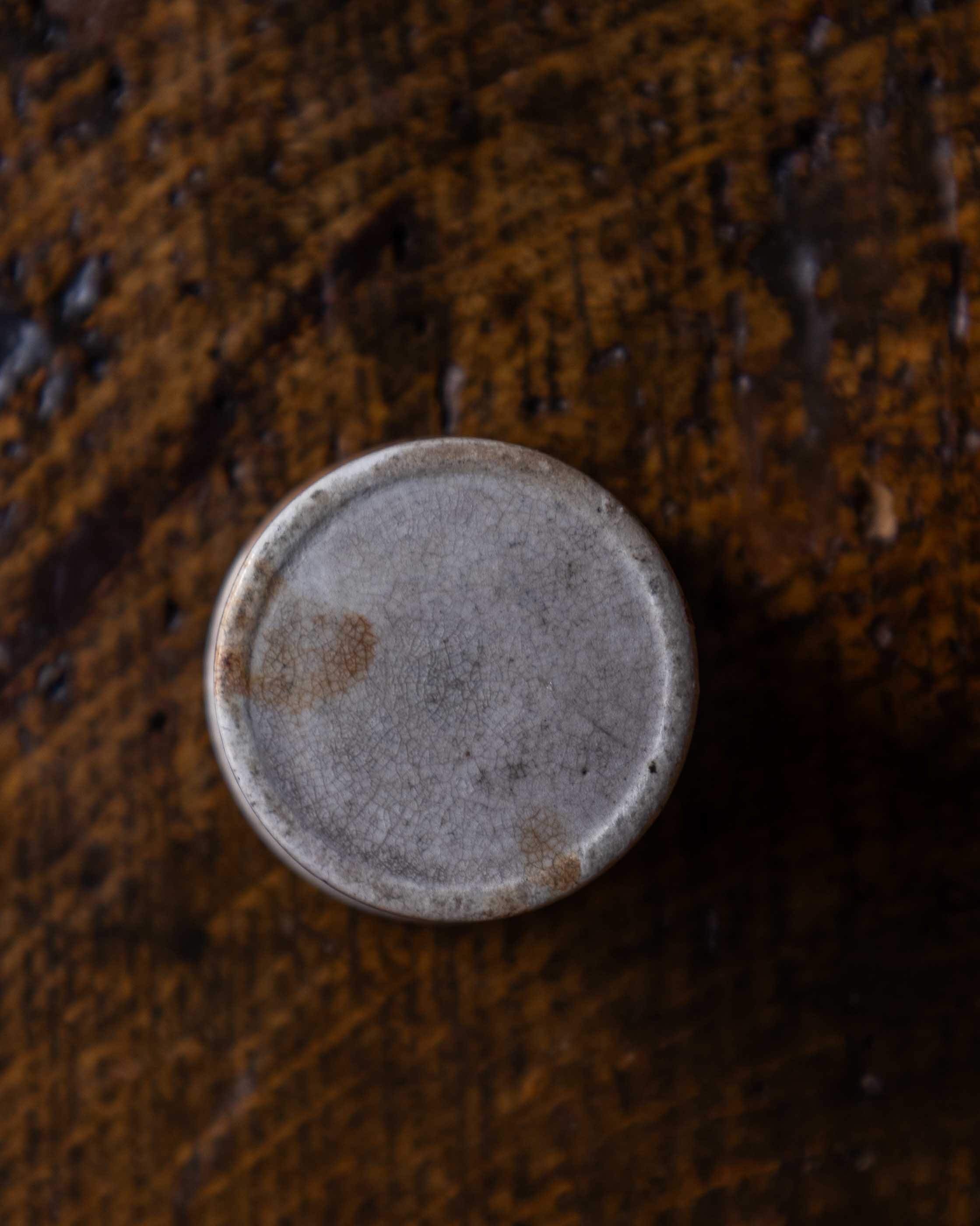 Ceramic pot on a wooden surface