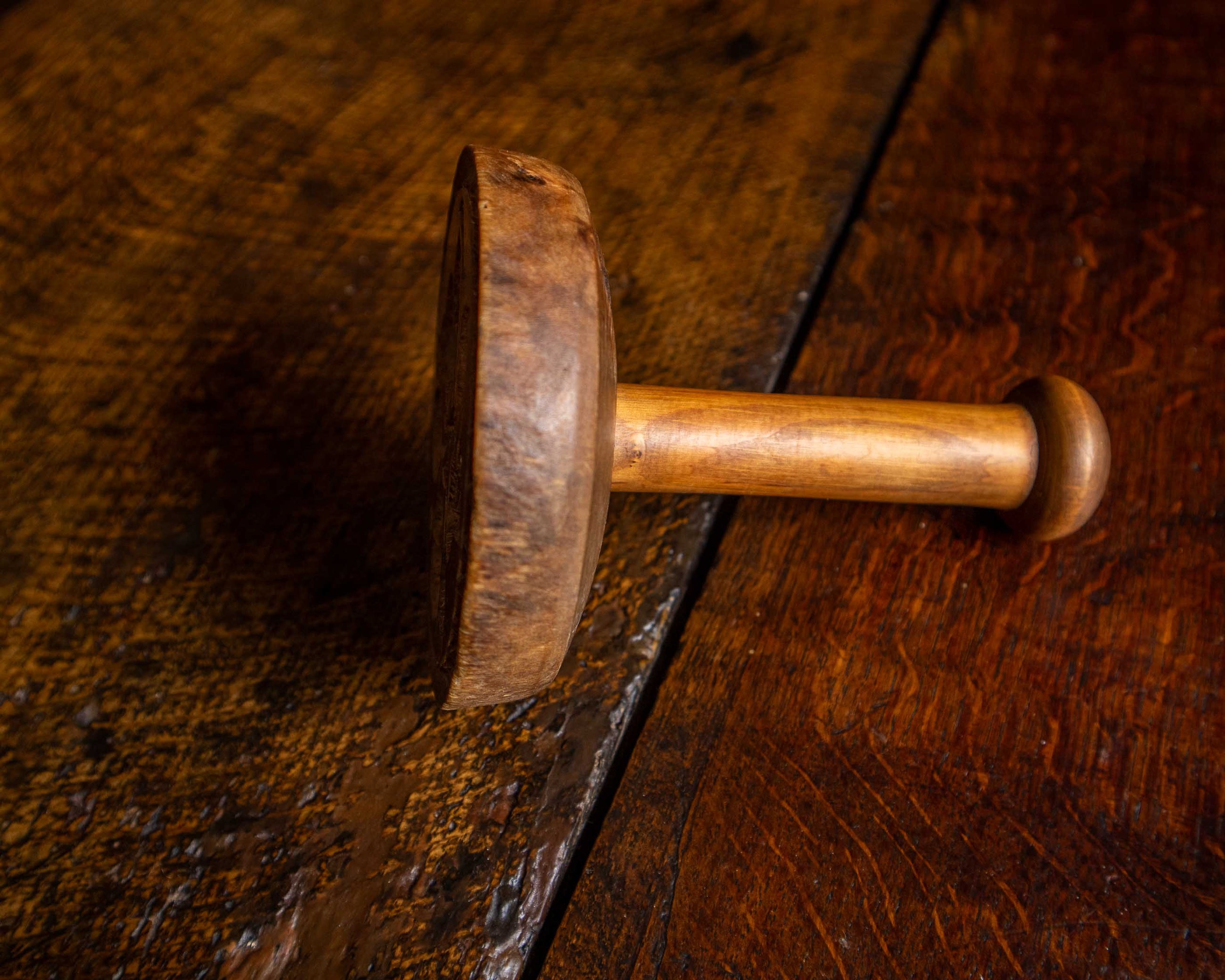 Wooden butter stamp on a wooden surface
