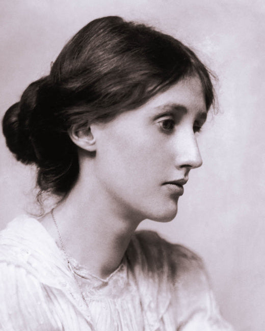Black and white portrait of Virginia Woolf with a bun hairstyle against a plain background