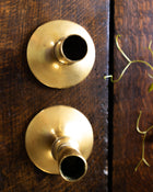 Brass candlestick on a wooden surface