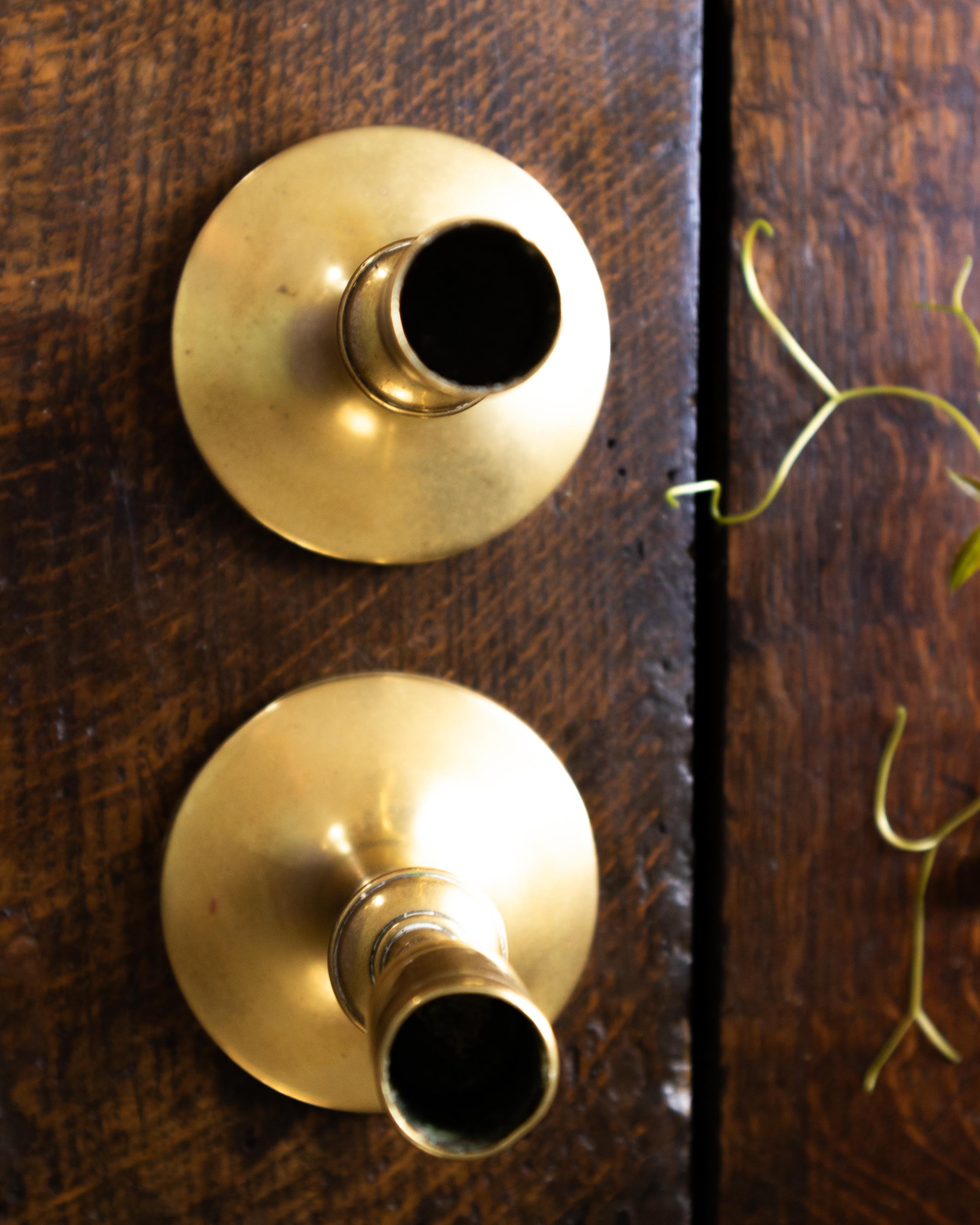 Brass candlestick on a wooden surface
