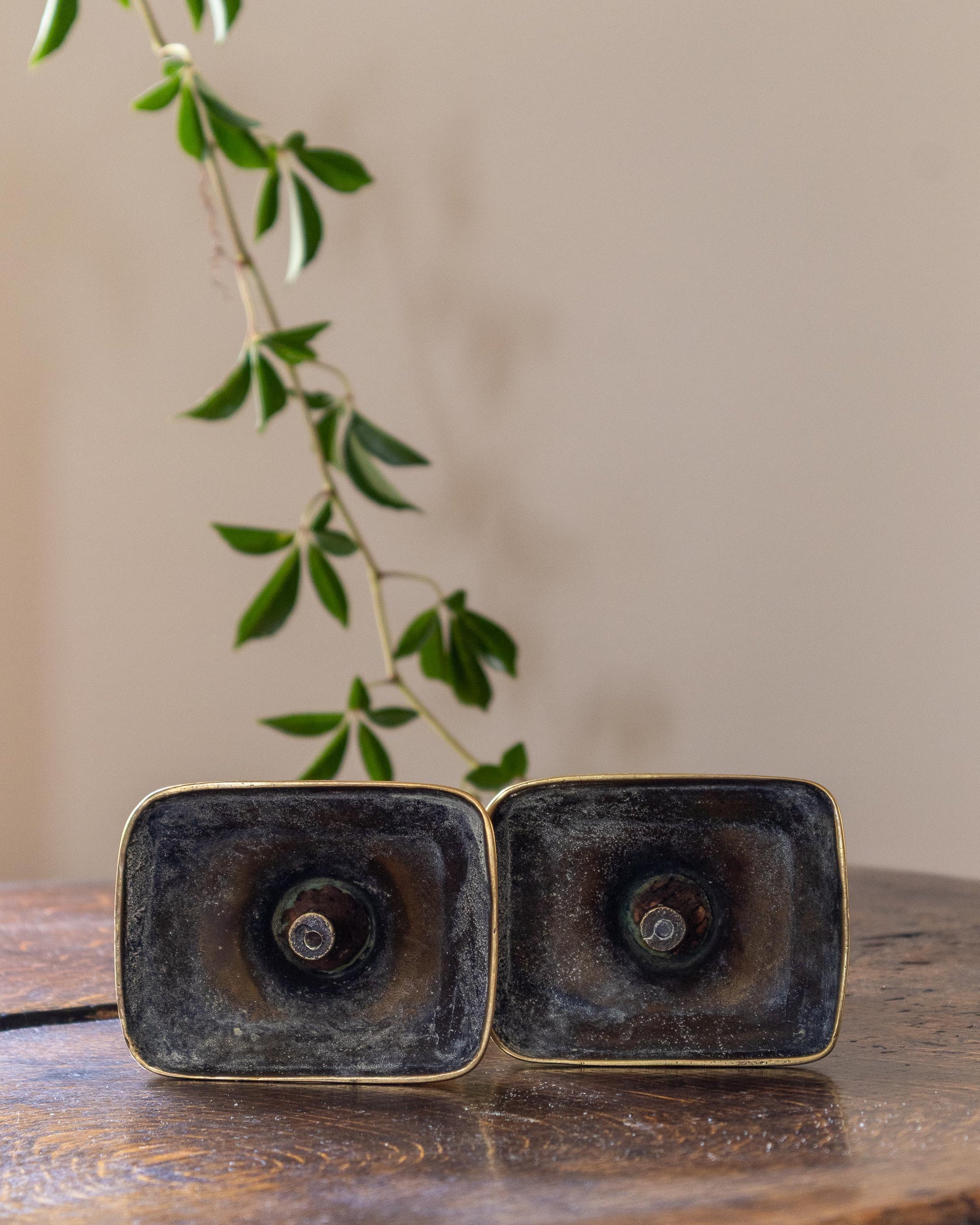 Brass candlestick on a wooden surface