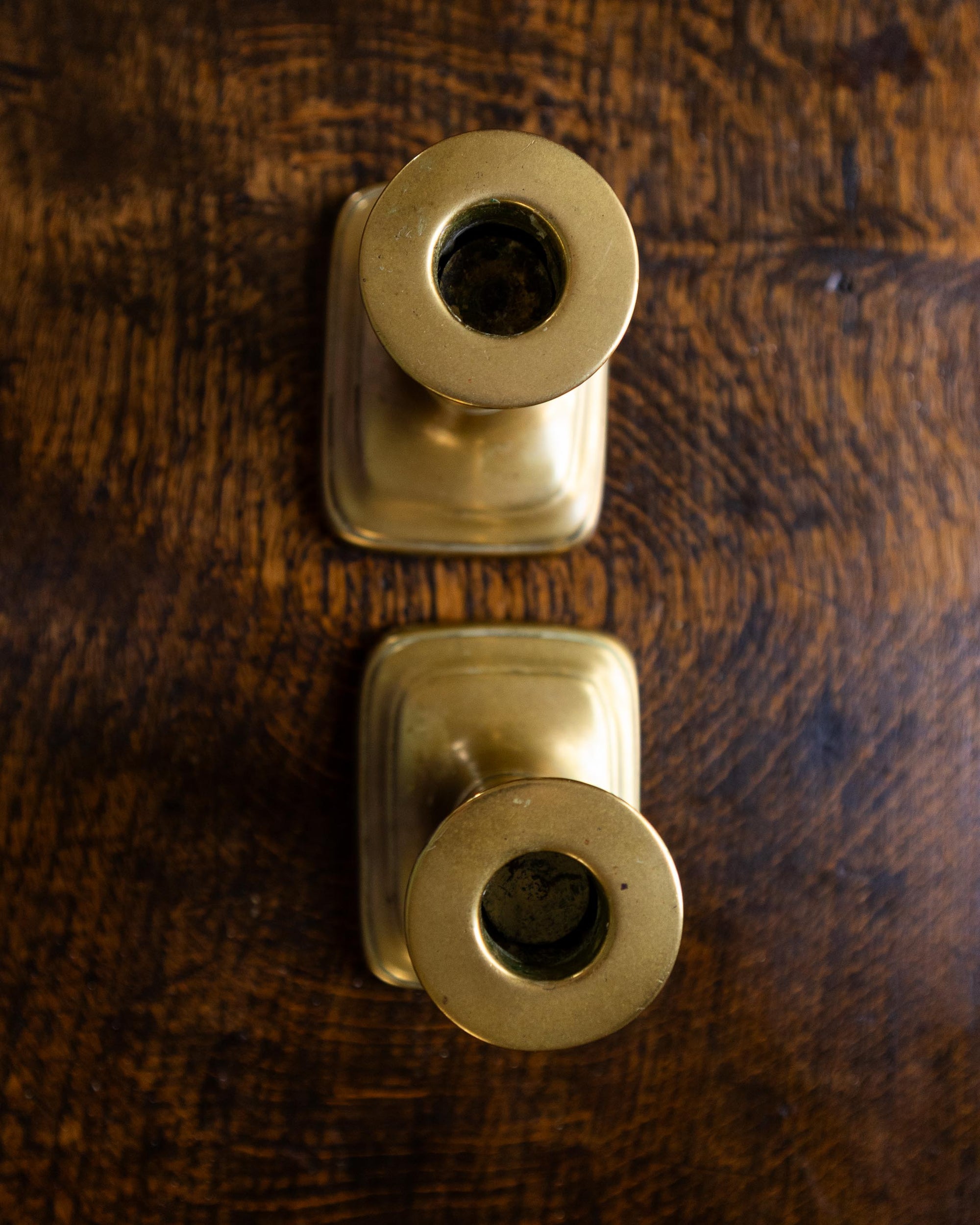 Brass candlestick on a wooden surface