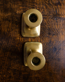 Brass candlestick on a wooden surface