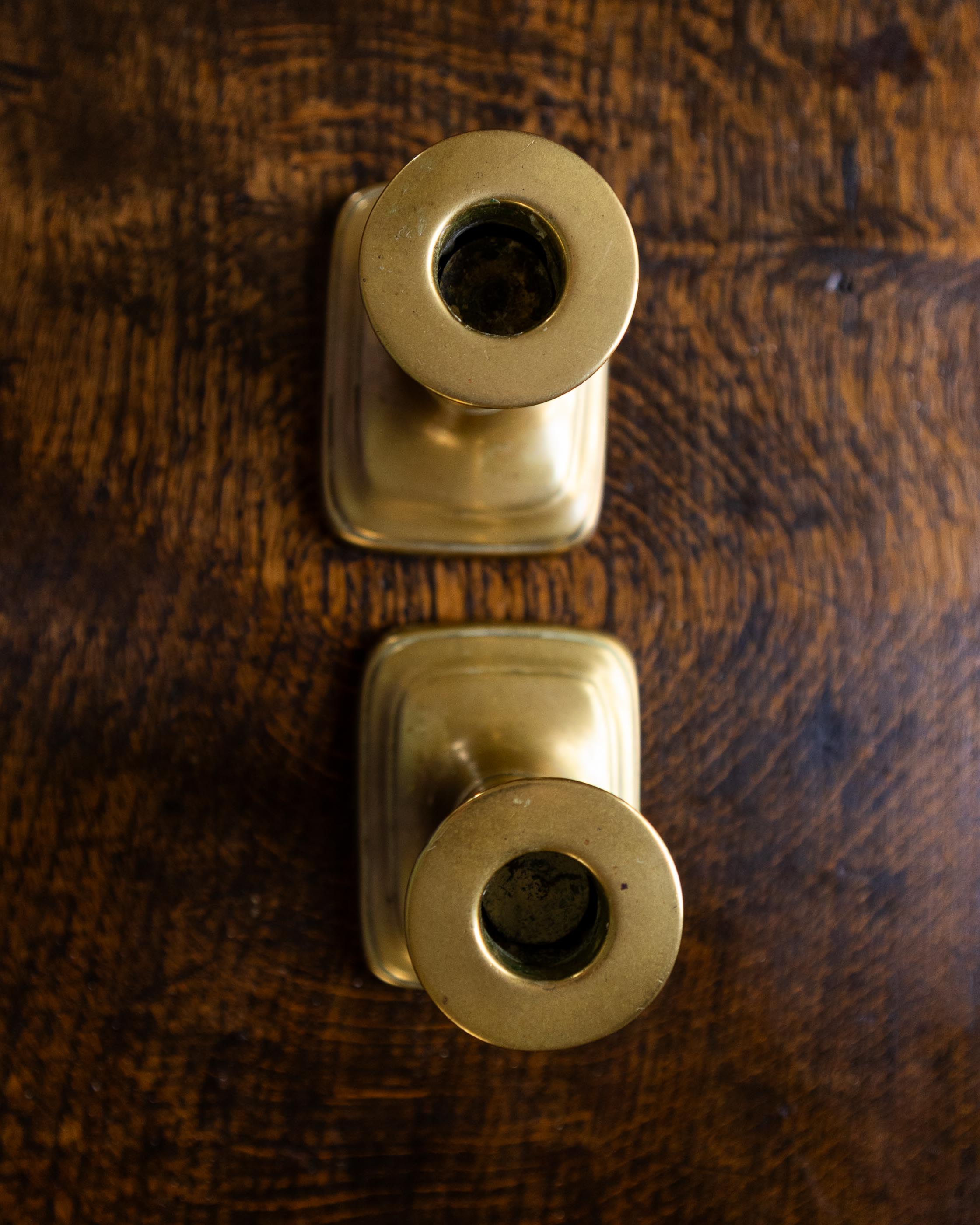 Brass candlestick on a wooden surface