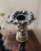 Decorative candle holder with intricate design on a blurred background
