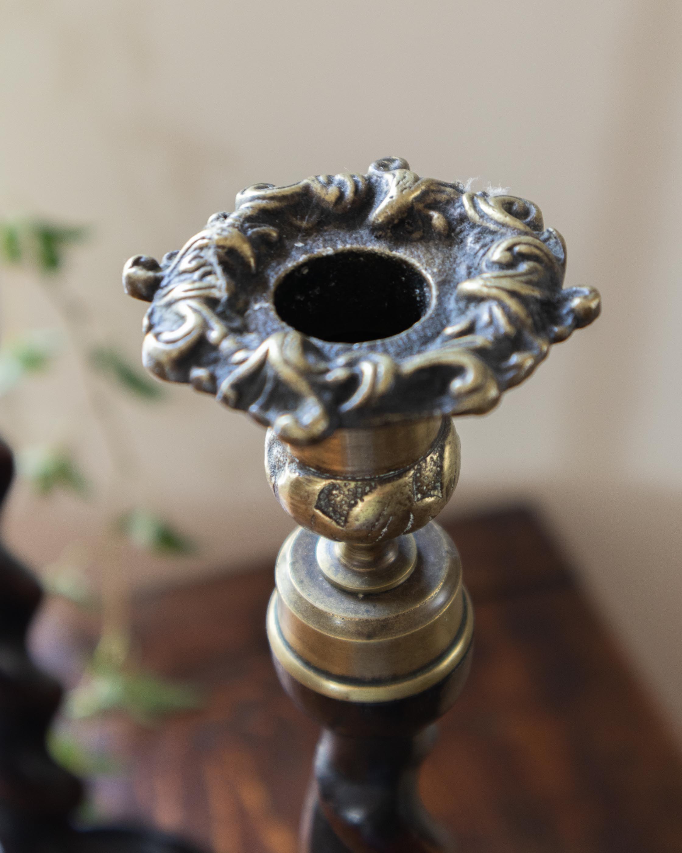Decorative candle holder with intricate design on a blurred background