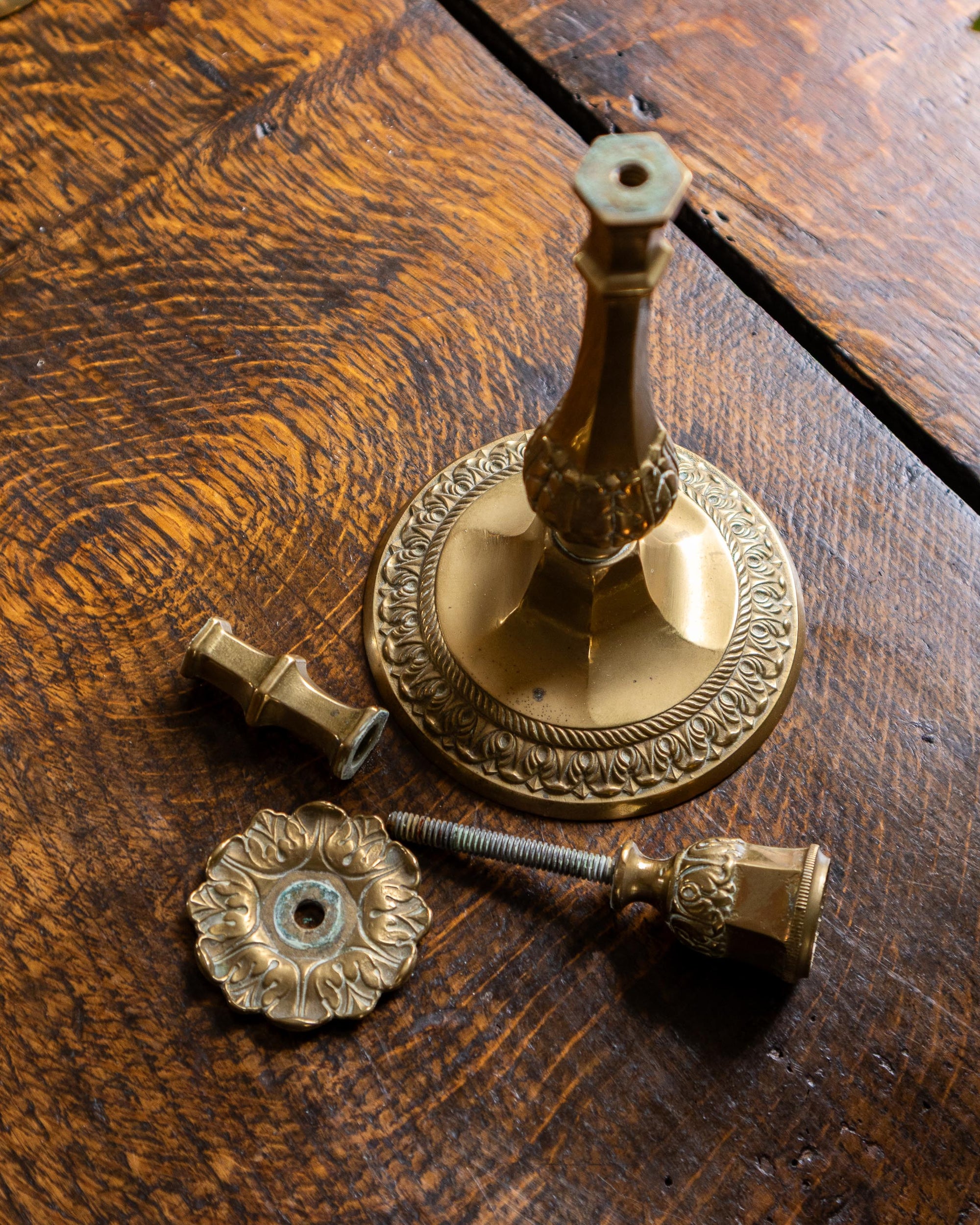 Decorative brass candlestick on a wooden surface