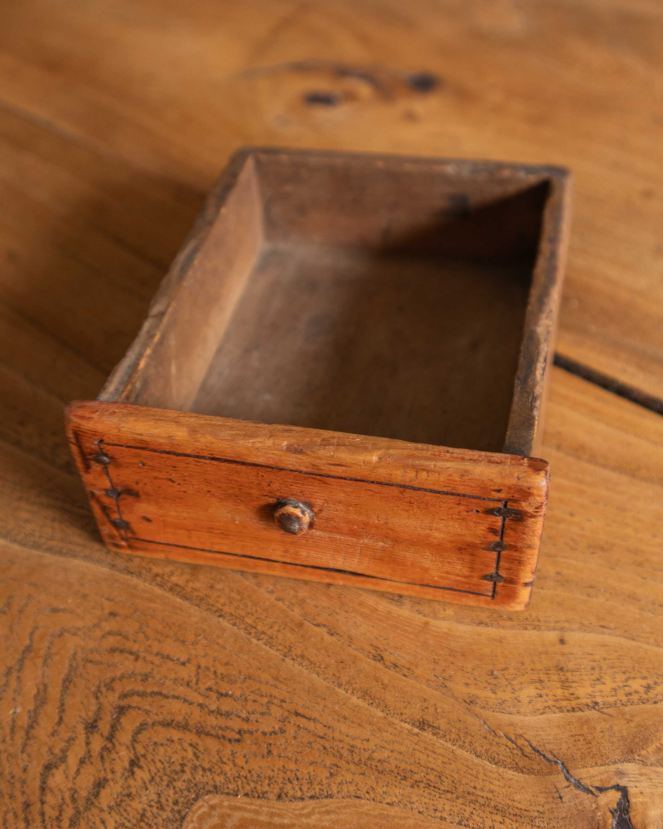 Small wooden drawer on a wooden surface
