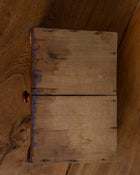 Wooden drawer with a handle on a wooden surface