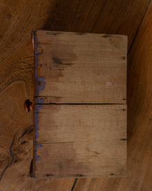 Wooden drawer with a handle on a wooden surface