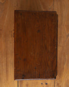 Wooden cabinet with a worn surface on a wooden background