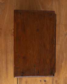 Wooden cabinet with a worn surface on a wooden background