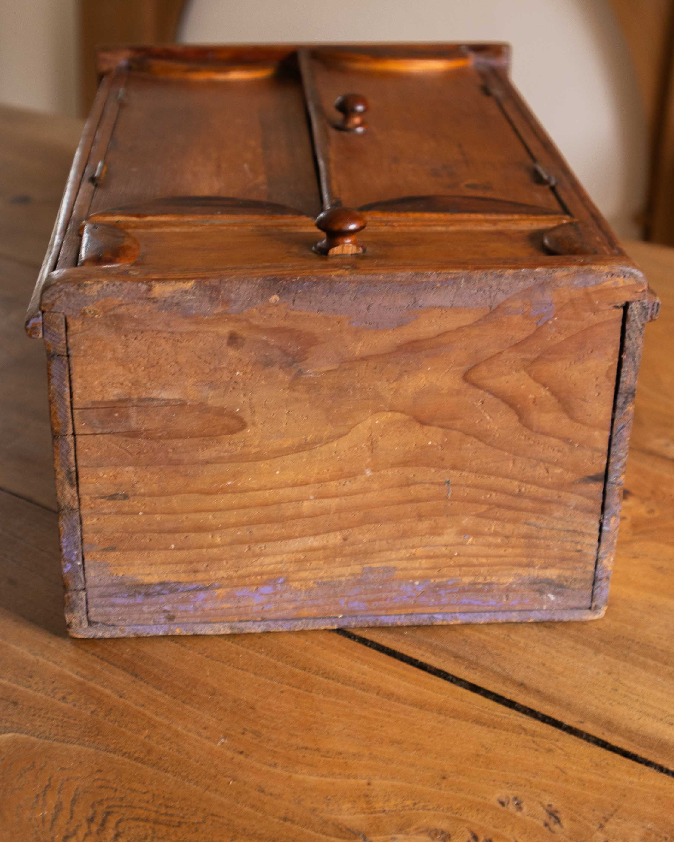 Wooden cabinet with doors on a wooden surface