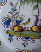 Decorative ceramic plate with floral and bird design