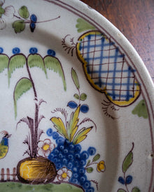 Decorative ceramic plate with floral and bird designs