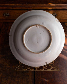 White ceramic plate on a wooden surface