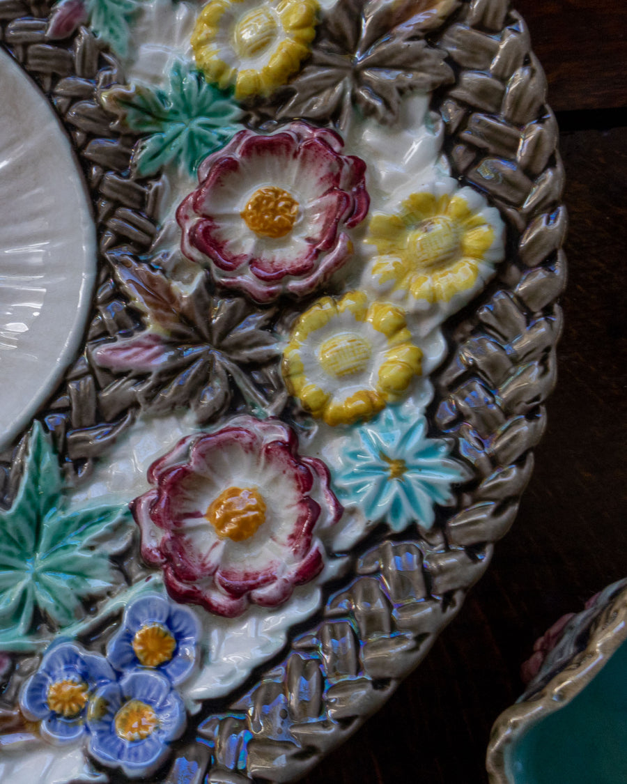 Decorative plate with floral designs on a wooden surface