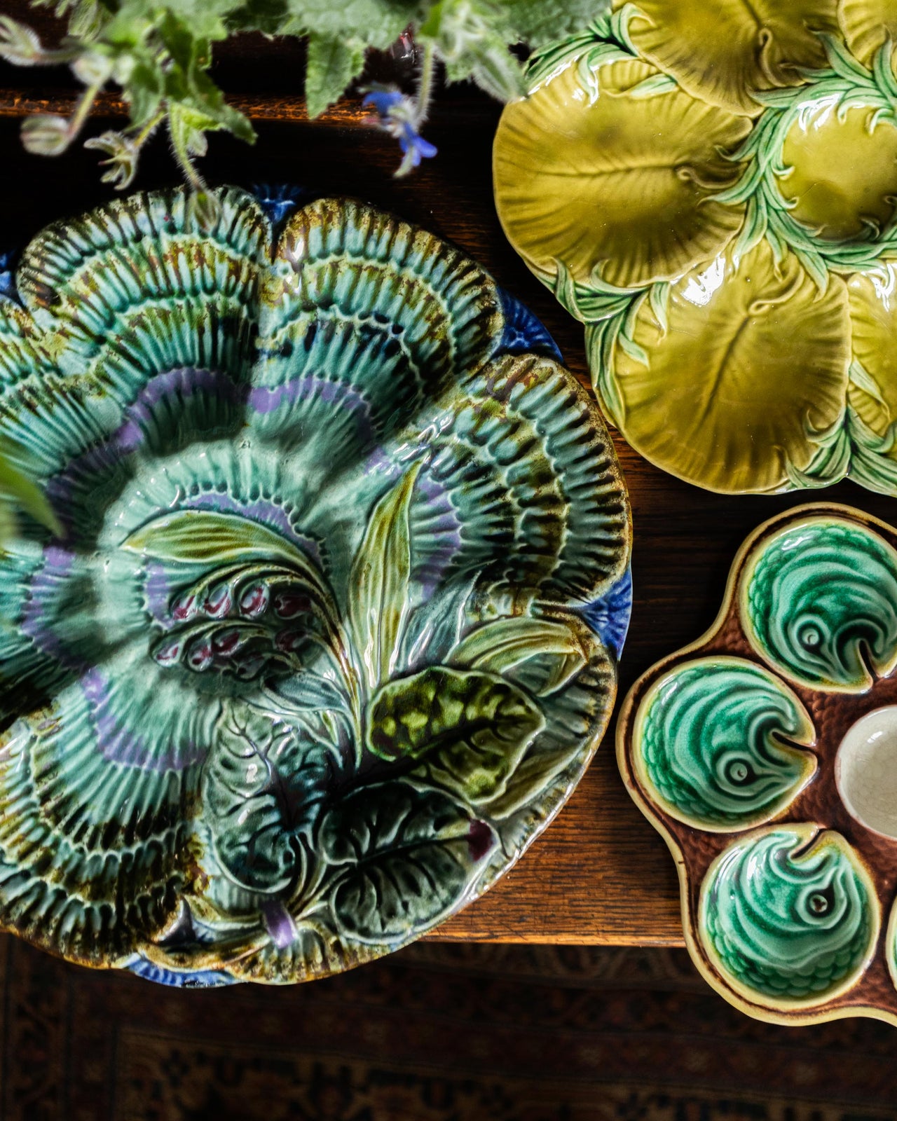 Decorative ceramic plates with floral designs on a wooden surface