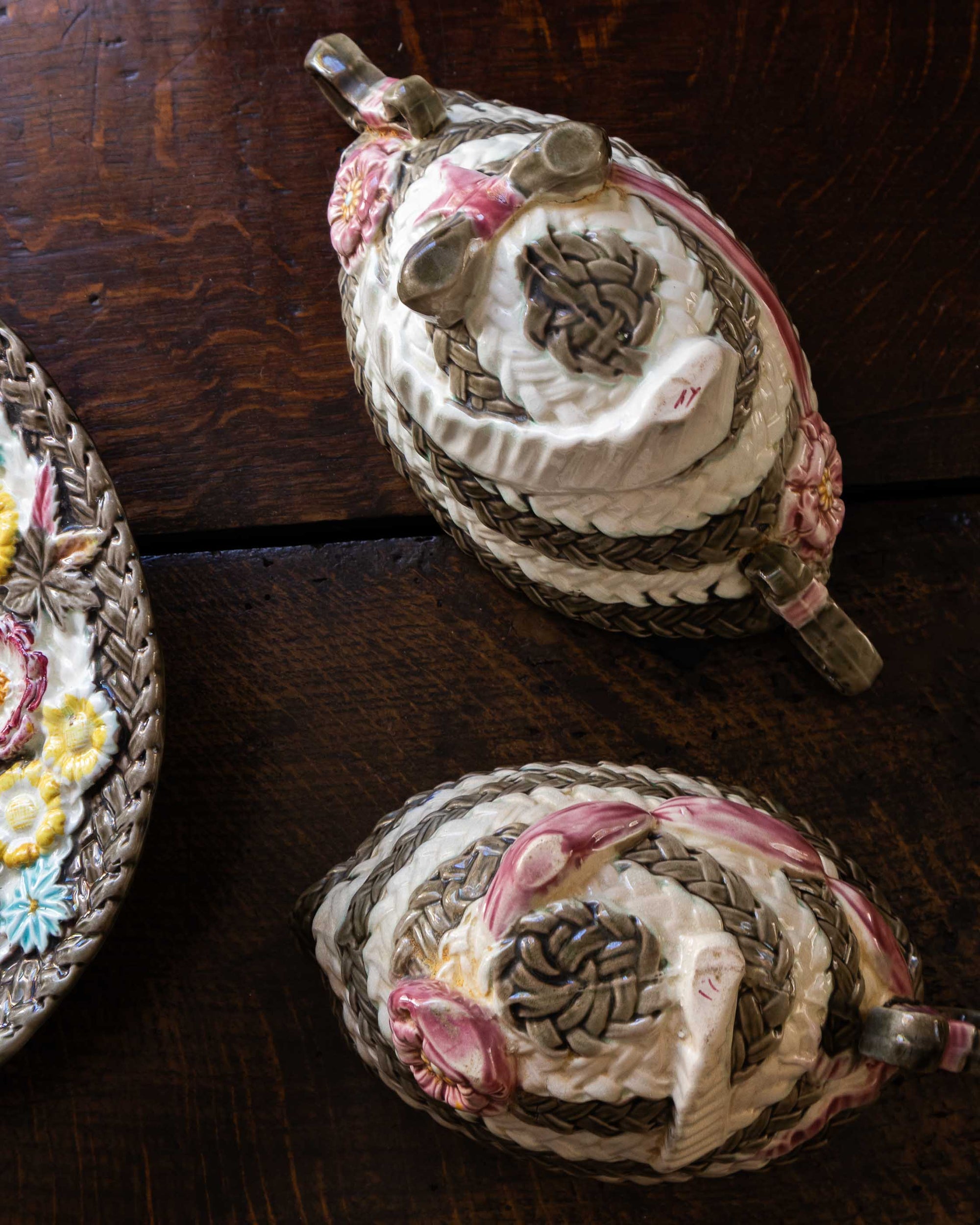 Decorative woven baskets with intricate patterns on a wooden surface