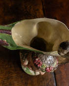 Ceramic jug on a wooden surface