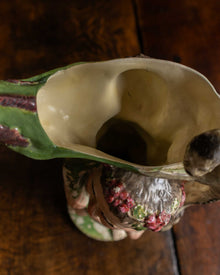 Ceramic jug on a wooden surface