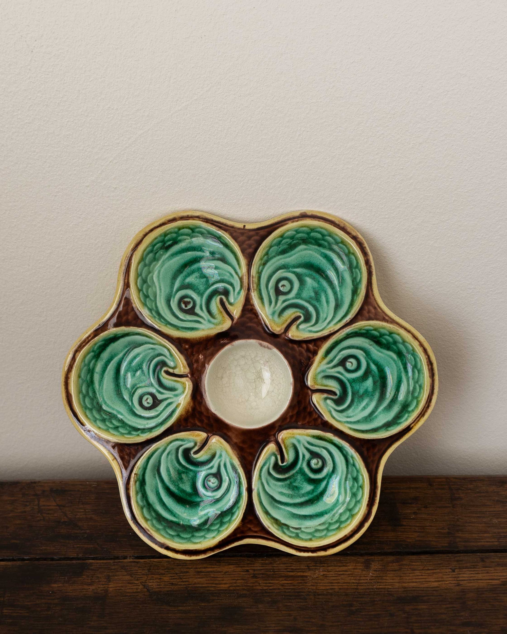 Ceramic oyster plate on a wooden surface