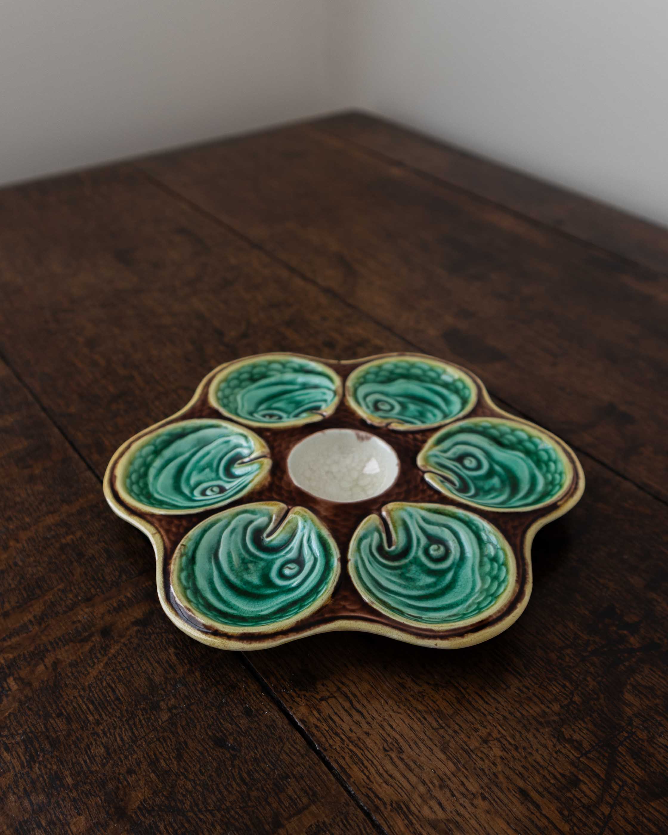 Ceramic oyster plate on a wooden surface