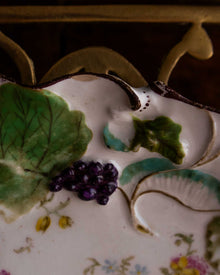 Decorative ceramic plate with floral and leaf patterns