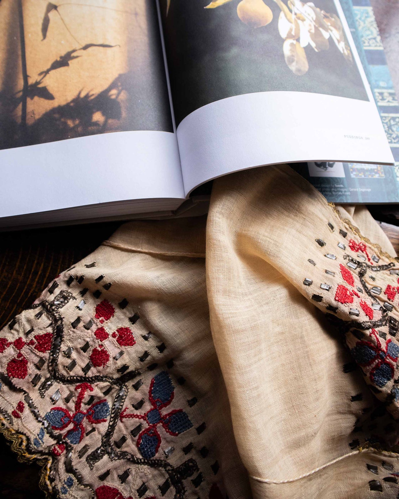 Embroidered fabric with intricate patterns on a book