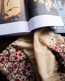 Embroidered fabric with intricate patterns on a book