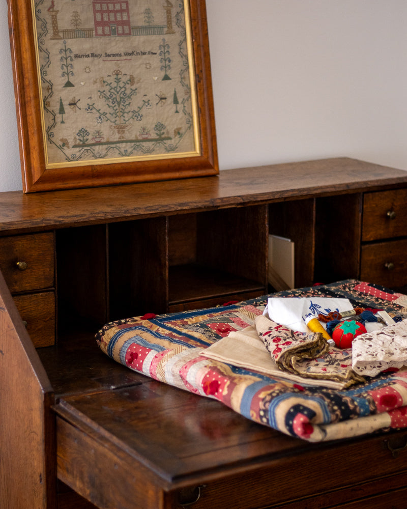 Antique Georgian sampler and patchwork quilt