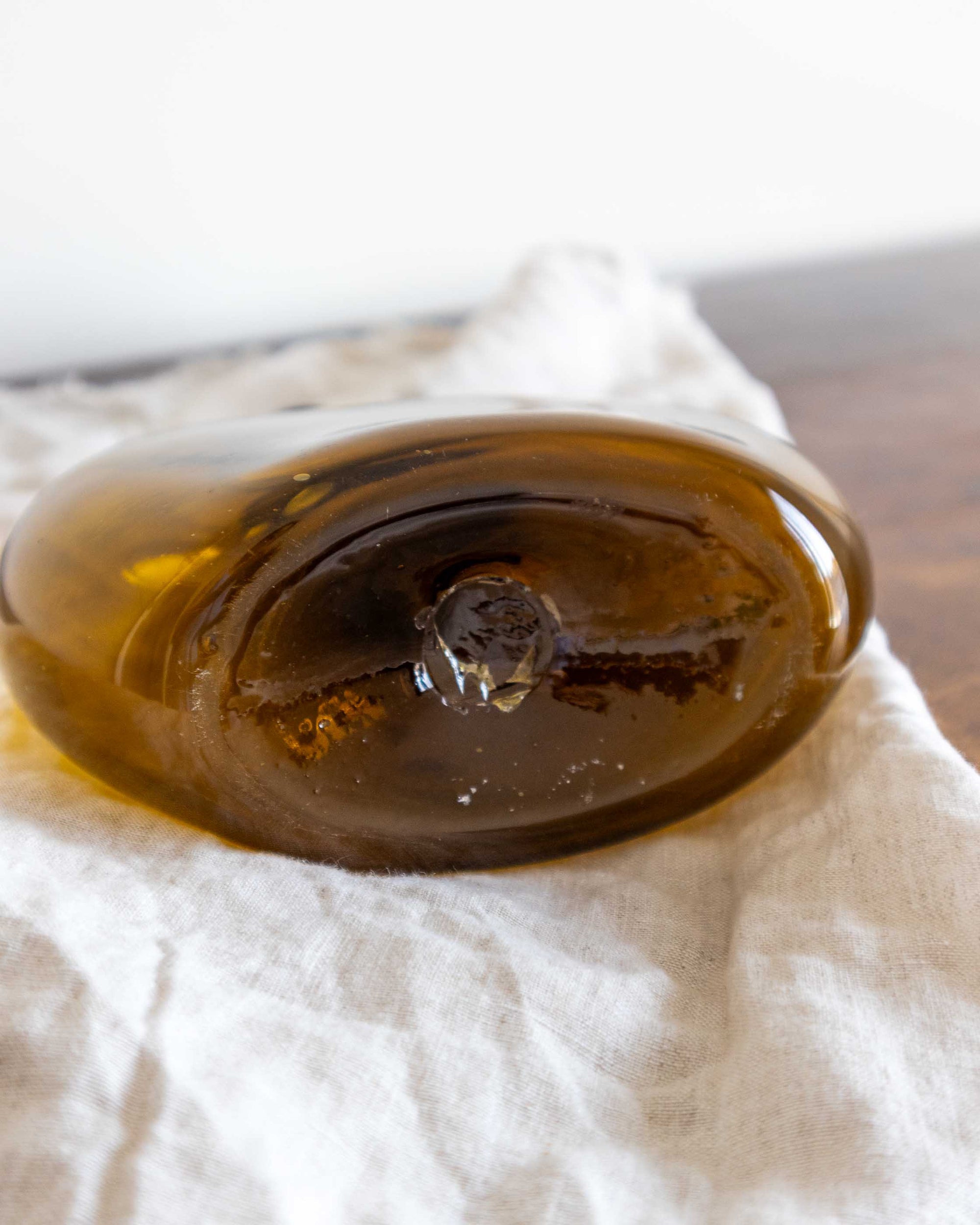 Close-up of a glass decanter on a white cloth
