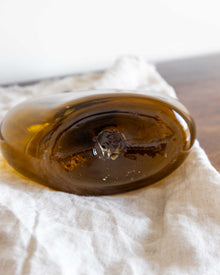 Close-up of a glass decanter on a white cloth