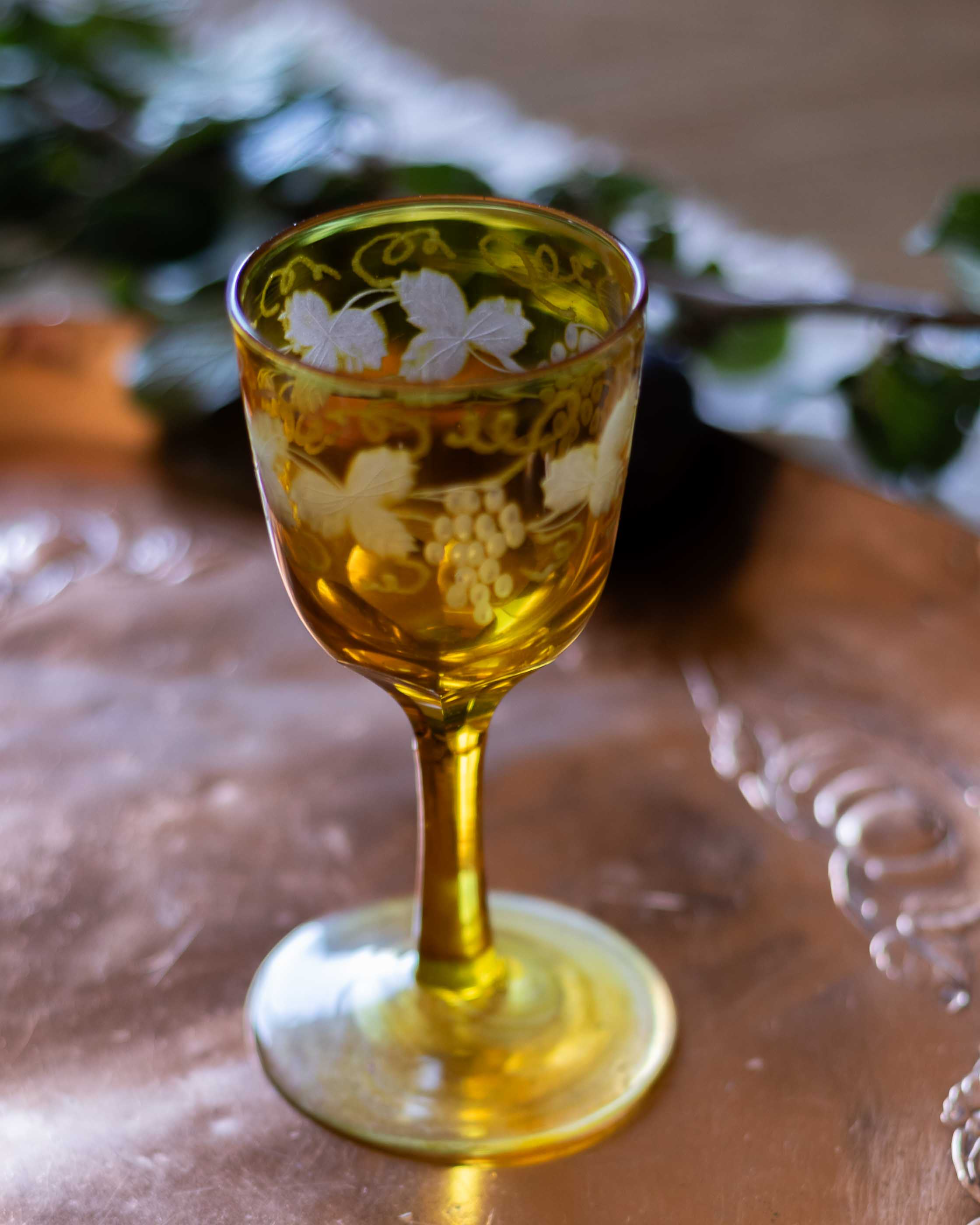 Decorative glass with floral patterns on a reflective surface