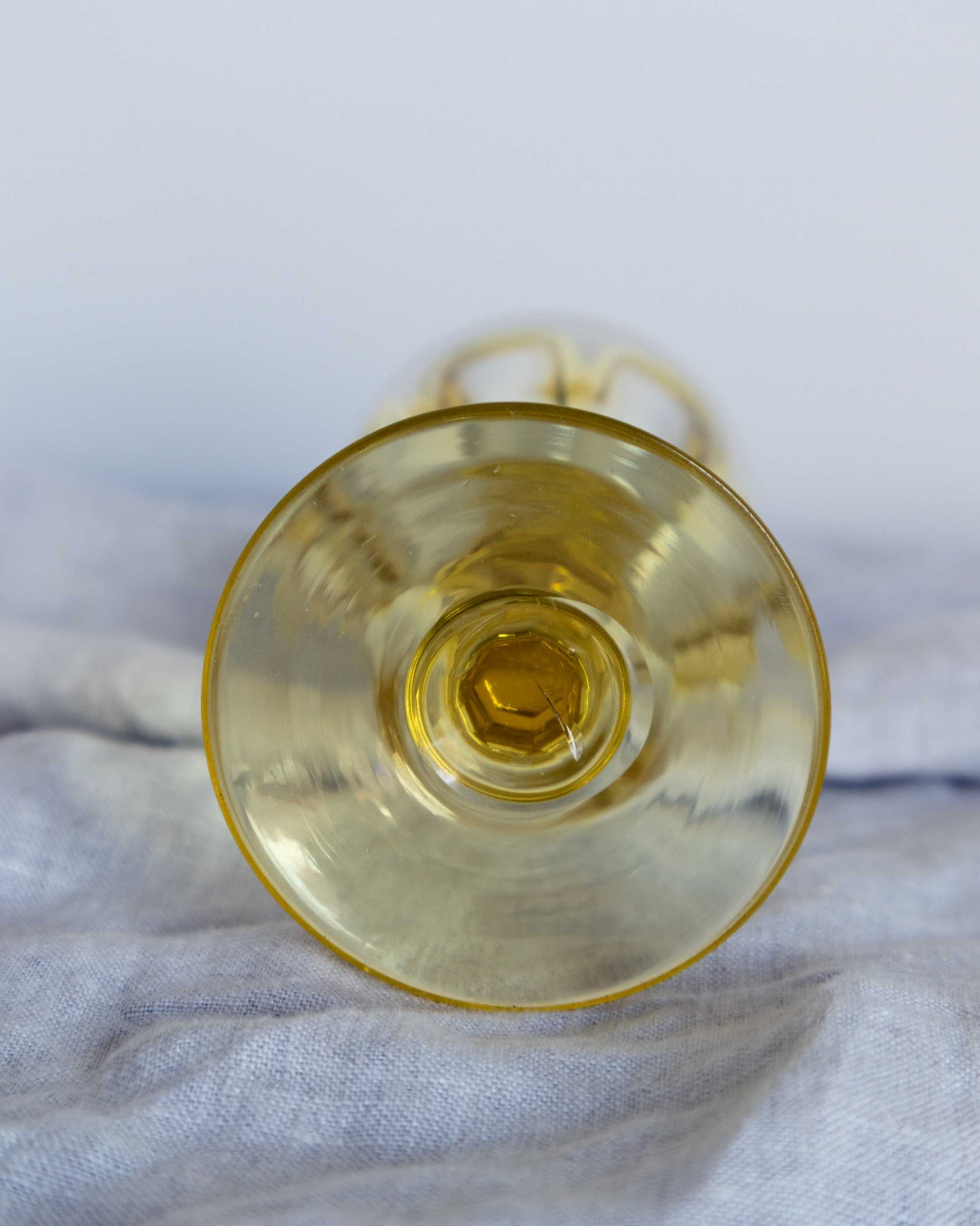 Clear glass on a textured white surface