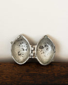 Lemon pewter ice cream mould on wooden surface